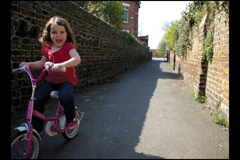 Katherine cycles through “poo alley” – “better than walking through it”, says her dad.